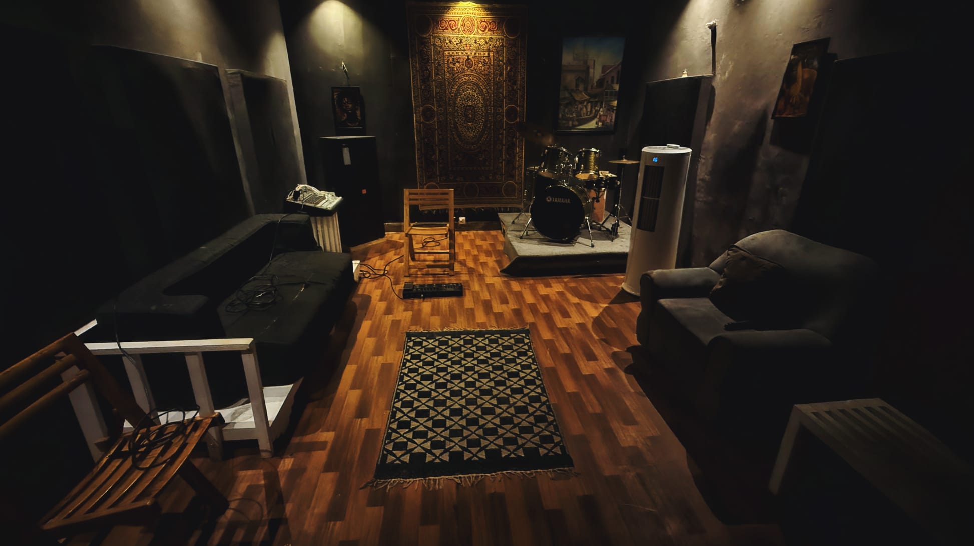 Jazba Studios acoustic jam room with drum riser, seating and treated walls